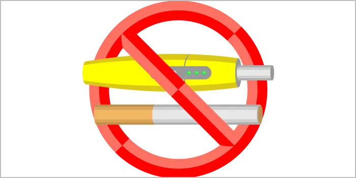 禁煙マークの加熱式タバコと紙巻きタバコ